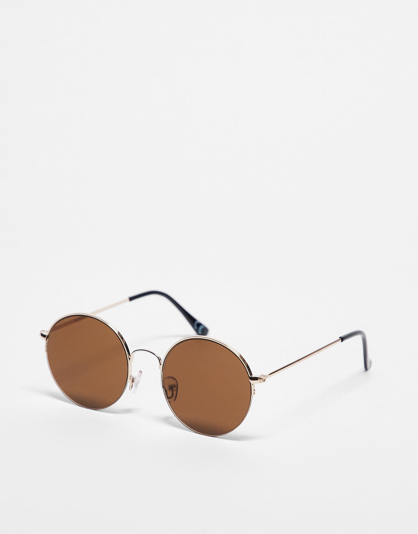 ASOS DESIGN 70s round sunglasses with light brown lens in gold