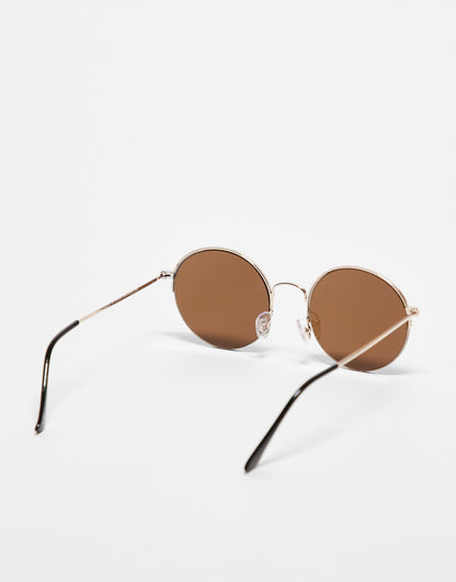 ASOS DESIGN 70s round sunglasses with light brown lens in gold