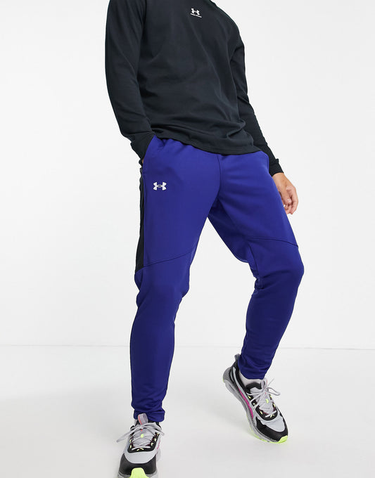 Under Armour Sportstyle graphic track pants in blue