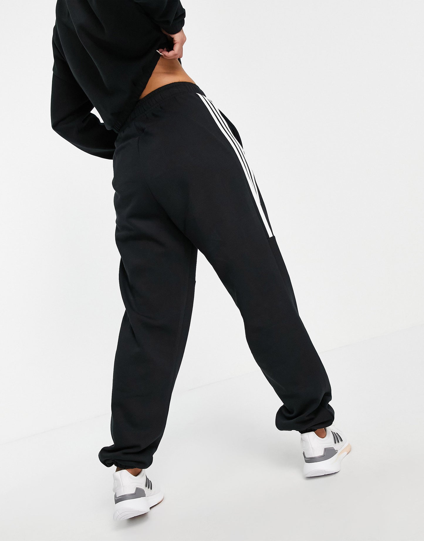 adidas Training oversized joggers with three stripes in black