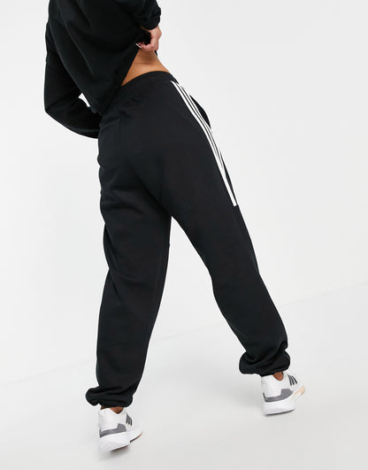 adidas Training oversized joggers with three stripes in black