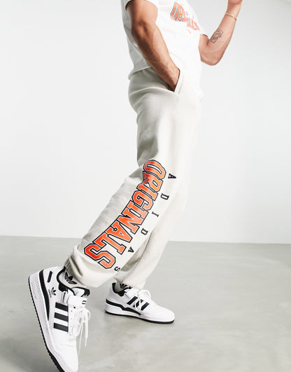 adidas Originals 'Retro Revival' logo graphics joggers in oatmeal