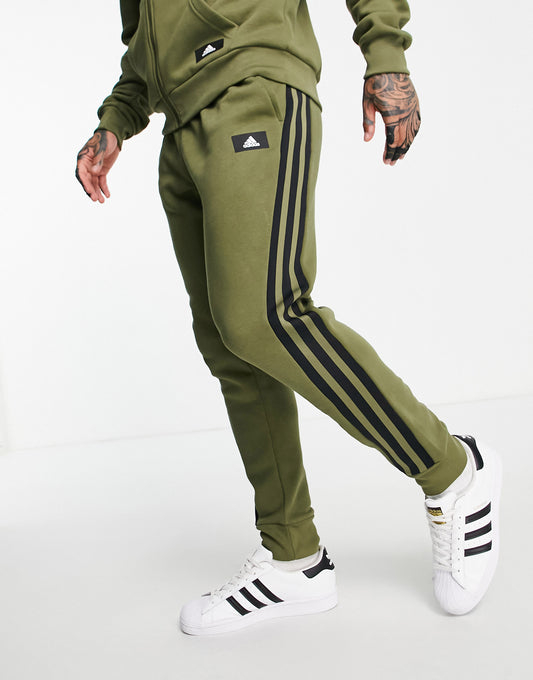 adidas joggers with three stripes in khaki