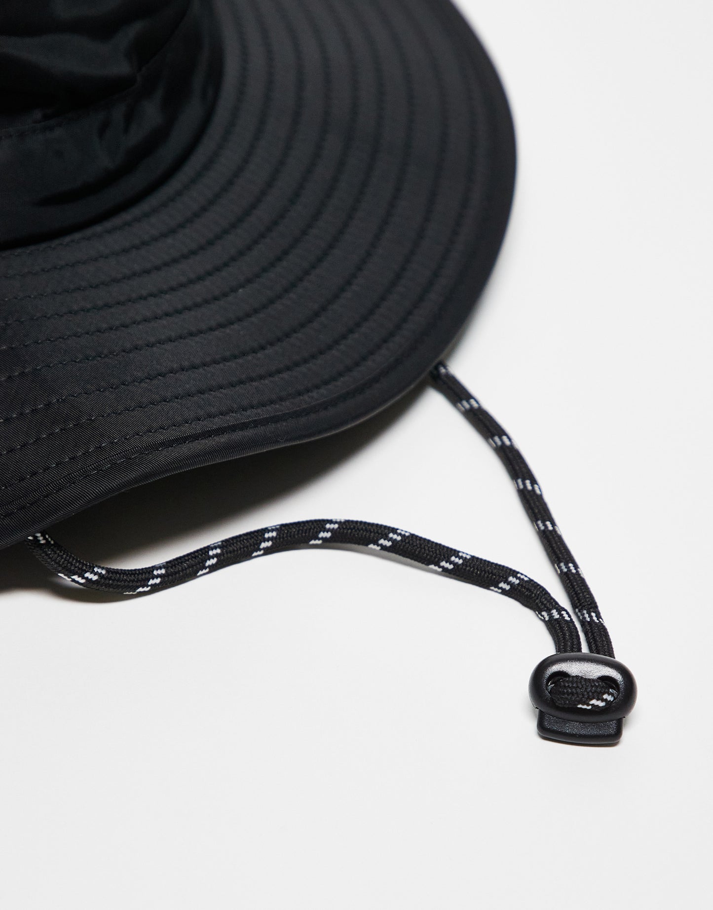 ASOS DESIGN safari bucket hat with contrast puller in black