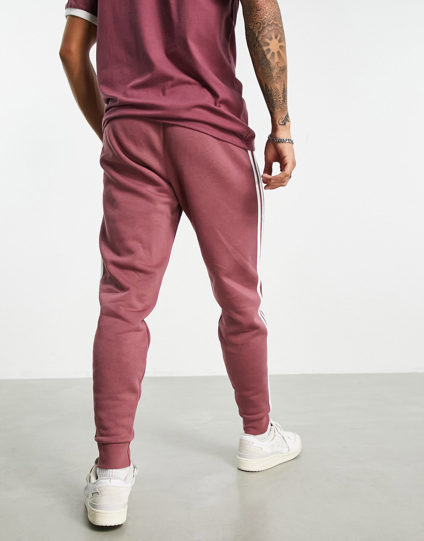 adidas Originals adicolor three stripe joggers in quiet crimson