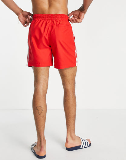 adidas Originals adicolor three stripe swim shorts in red