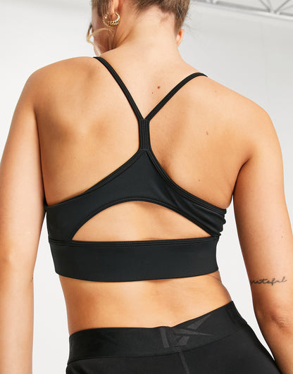 Reebok Training triangle back light-support padded sports bra in black