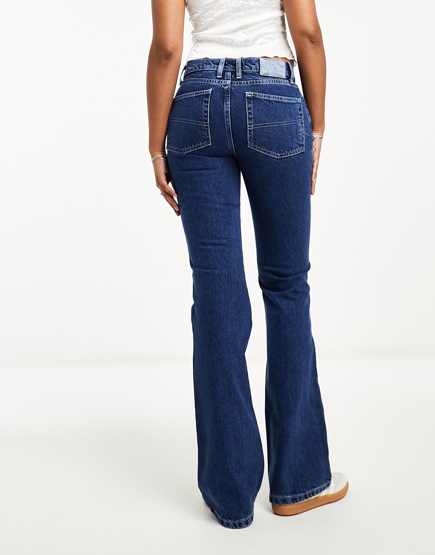 COLLUSION x008 rigid flare jean with white stitch in blue