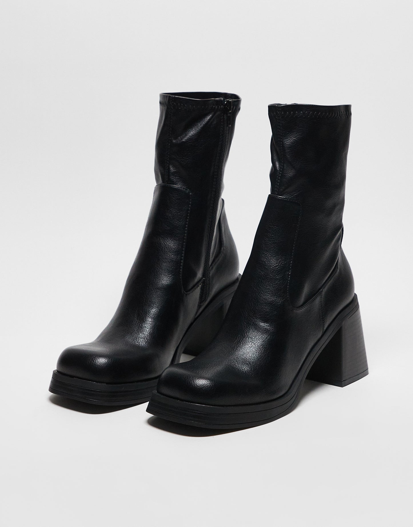 ASOS DESIGN Reversed mid-heel sock boots in black