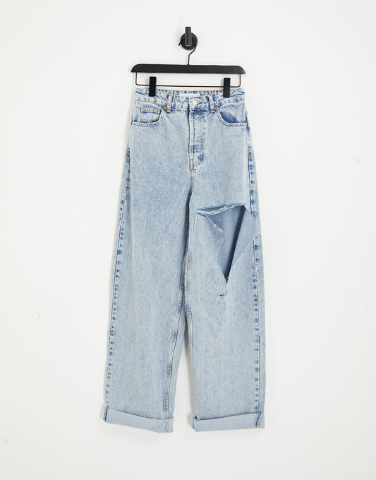 Topshop oversized Mom jeans with rip in bleach