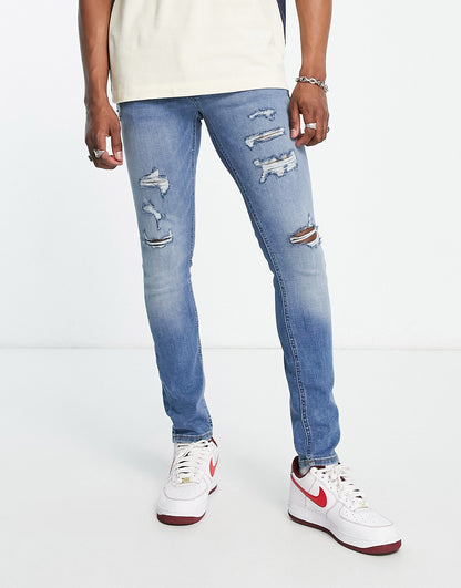 Jack & Jones Intelligence Liam skinny jeans with rips in blue