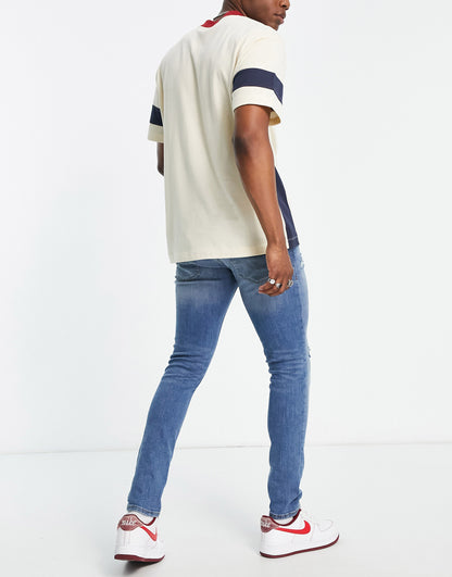 Jack & Jones Intelligence Liam skinny jeans with rips in blue