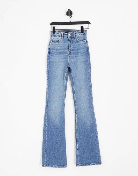 ASOS DESIGN Tall mid rise flare jeans in mid blue