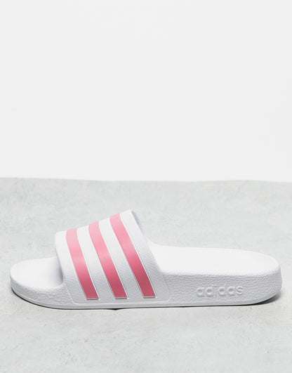 adidas Training Adilette sliders in white and pink