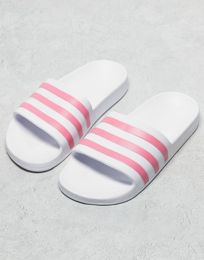 adidas Training Adilette sliders in white and pink