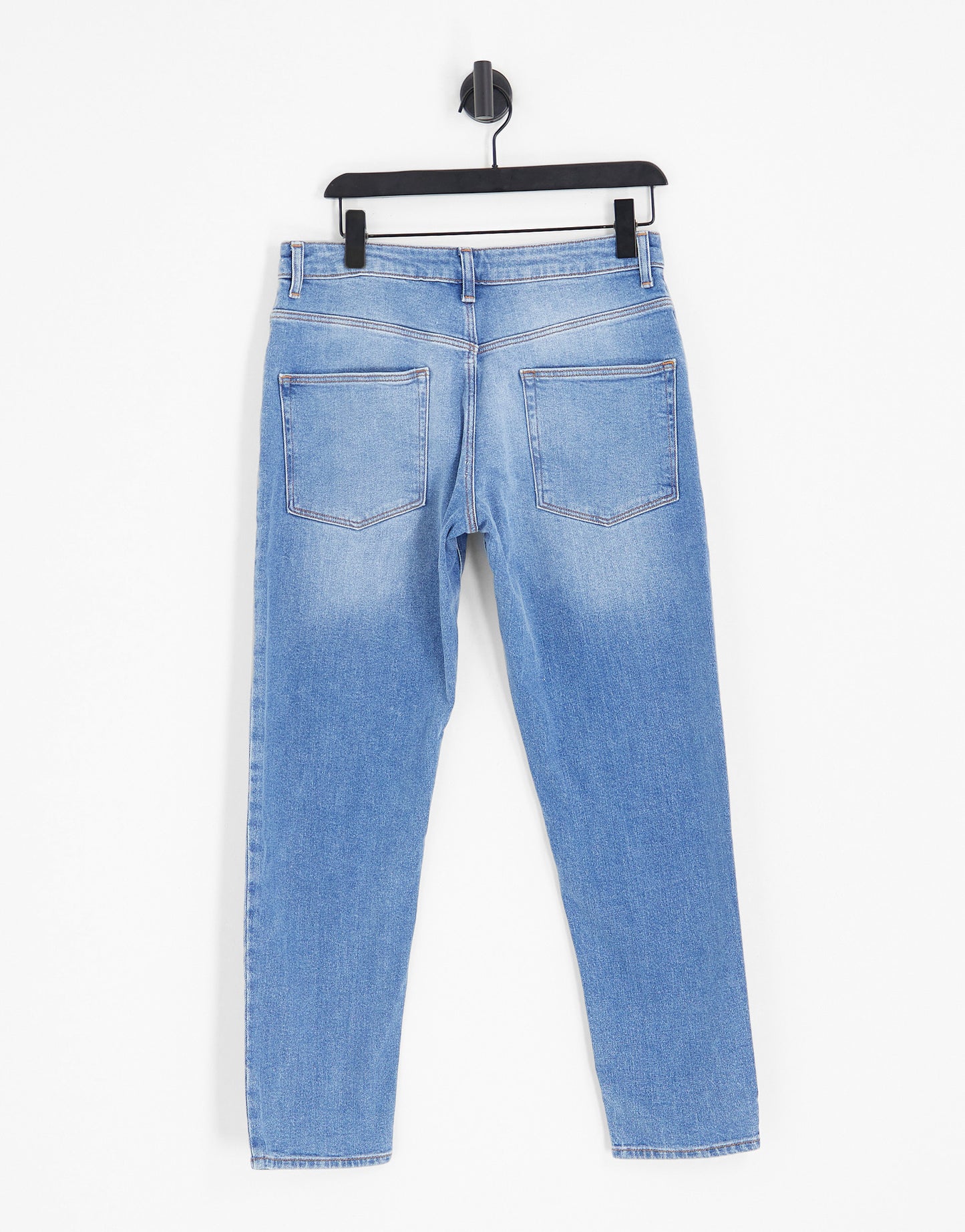 ASOS DESIGN stretch tapered jeans in 90s mid wash