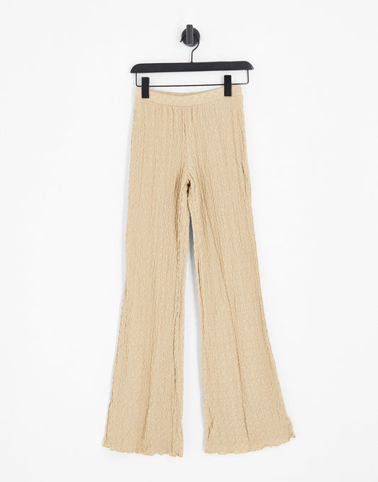 Monki lettuce hem jersey flared trousers in beige