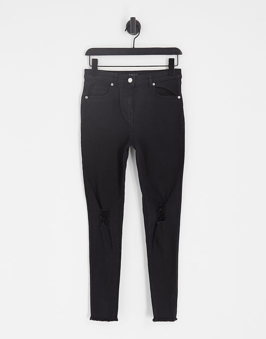 Parisian skinny jeans with ripped knee in black