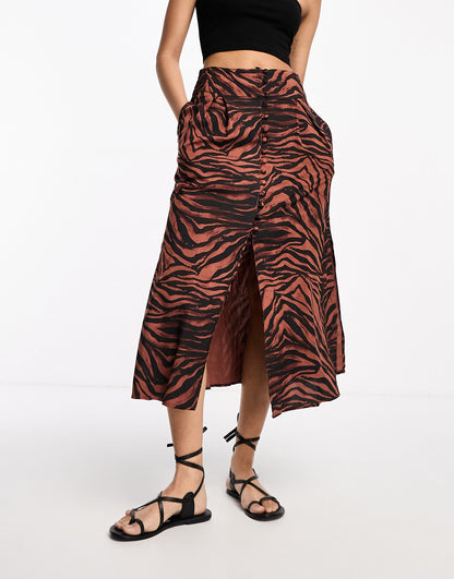 ASOS DESIGN button through midi skirt with split in dark zebra print