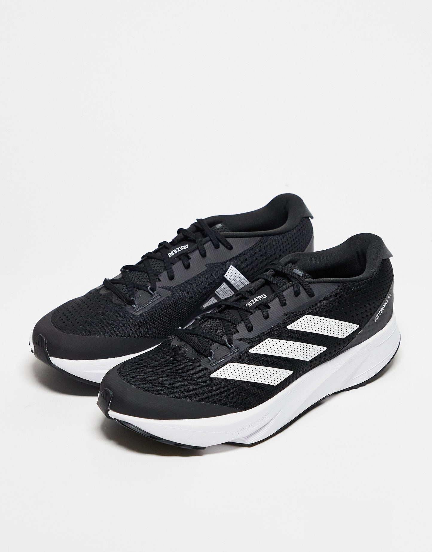 adidas Running Adizero SL20 trainers in black and white