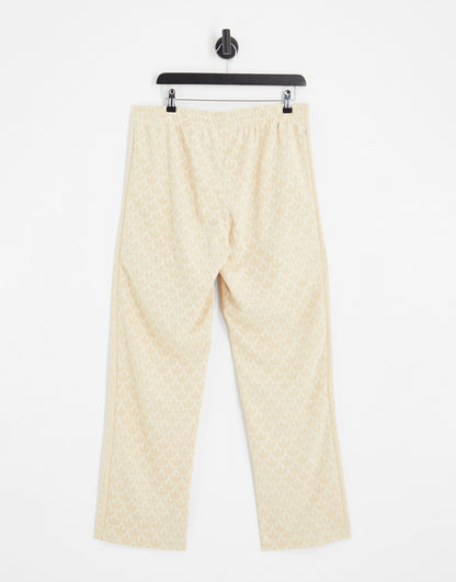 adidas Originas Trefoil monogram trackpants in neutral