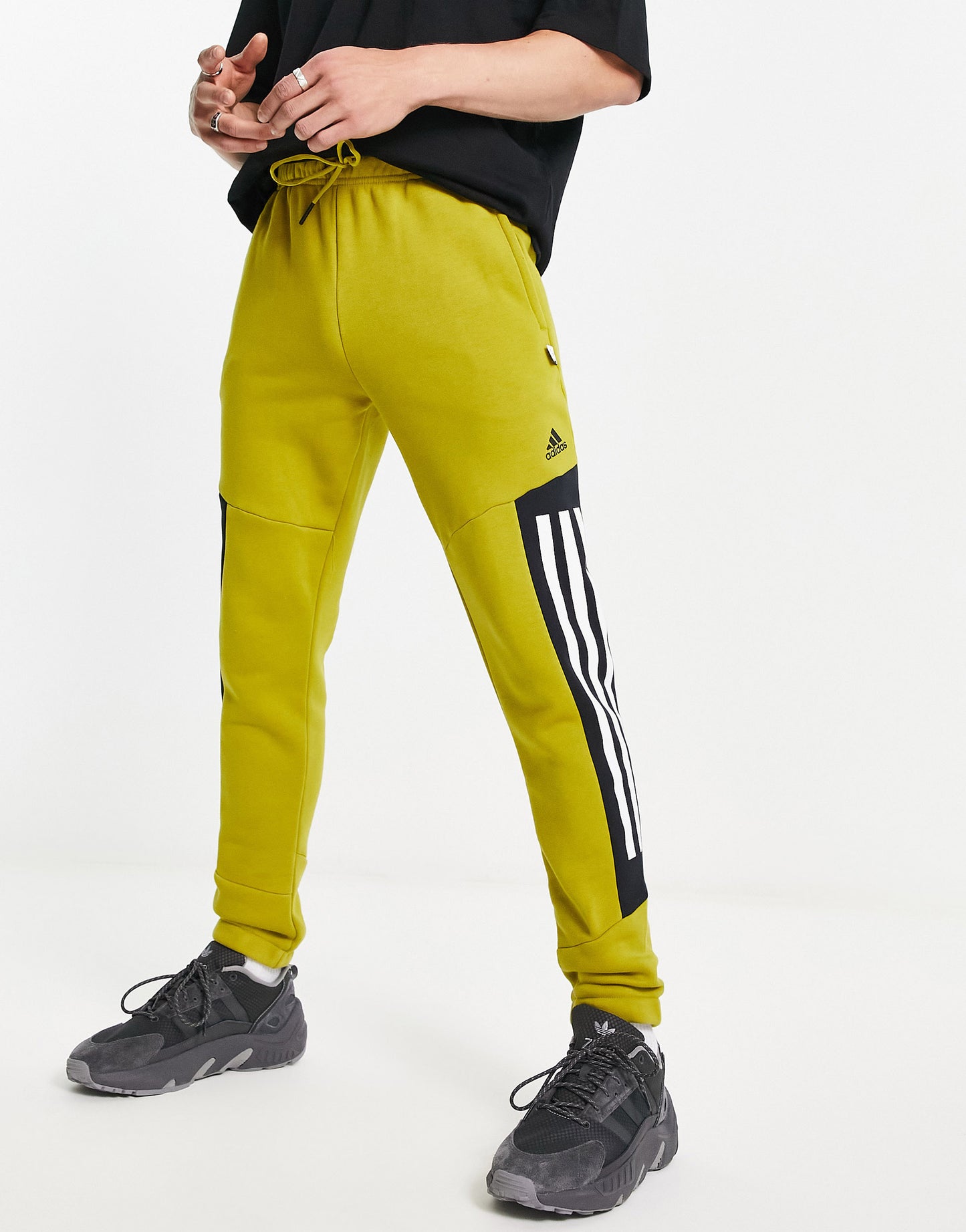 adidas Sportstyle Future Icons 3 stripe joggers in green