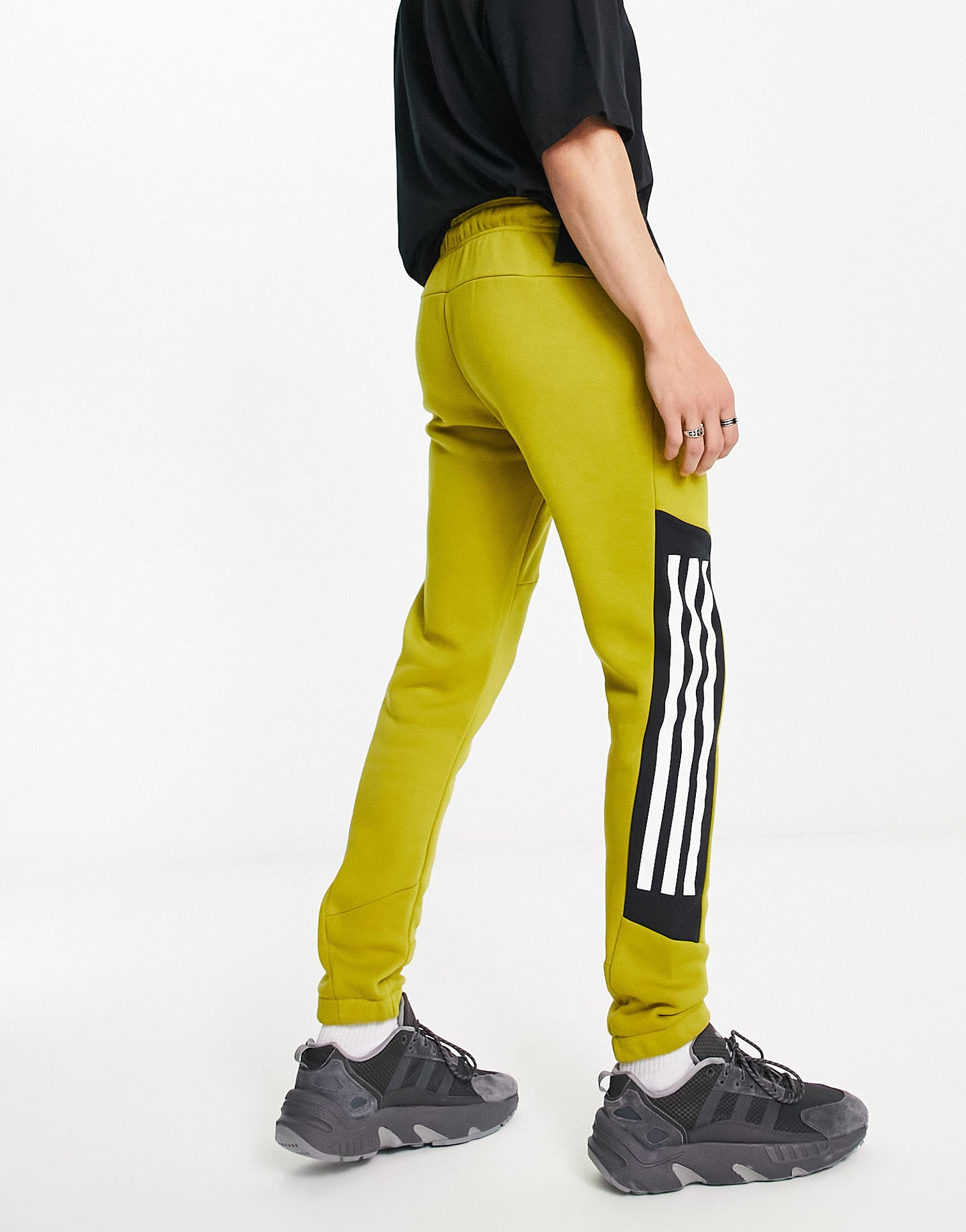 adidas Sportstyle Future Icons 3 stripe joggers in green