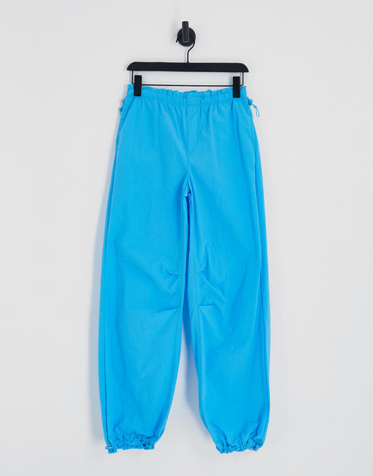 Bershka baggy parachute tech pant in blue