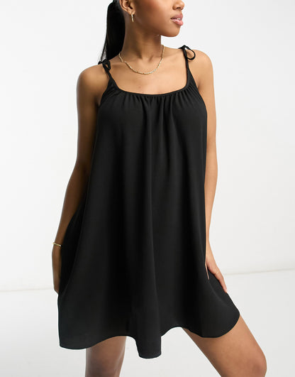 ASOS DESIGN tie strap detail trapeze mini slip dress in black