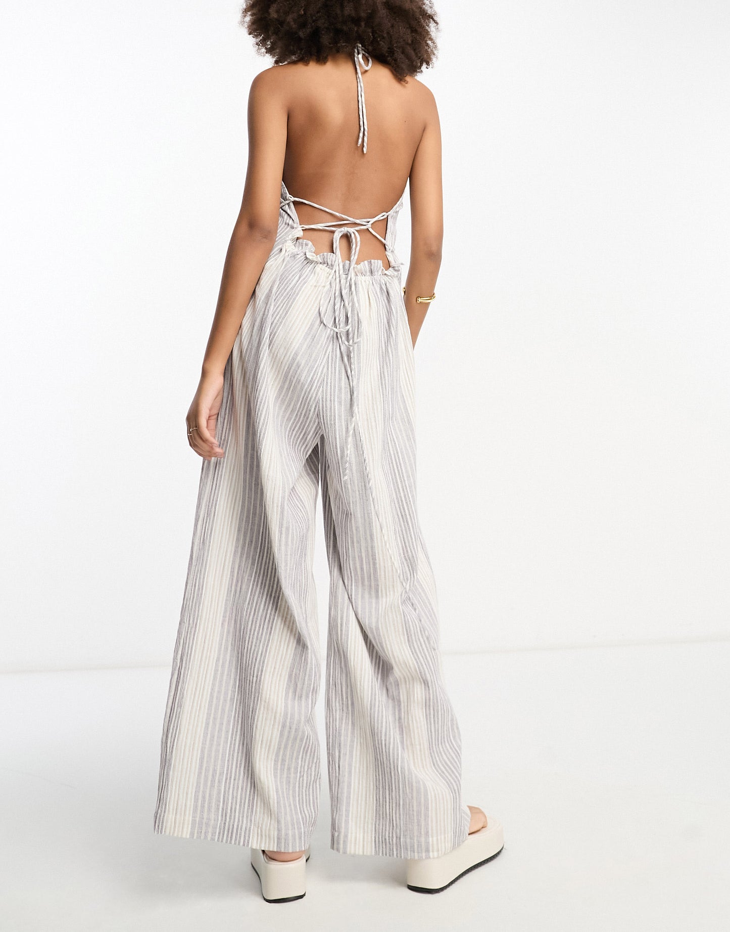 ASOS DESIGN crinkle frill halterneck jumpsuit with wide leg in stripe