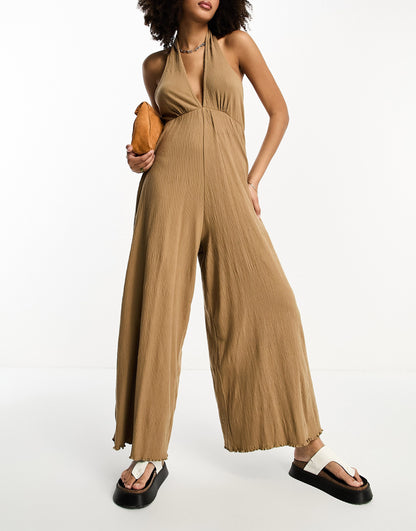 ASOS DESIGN crinkle jersey halter jumpsuit in mocha