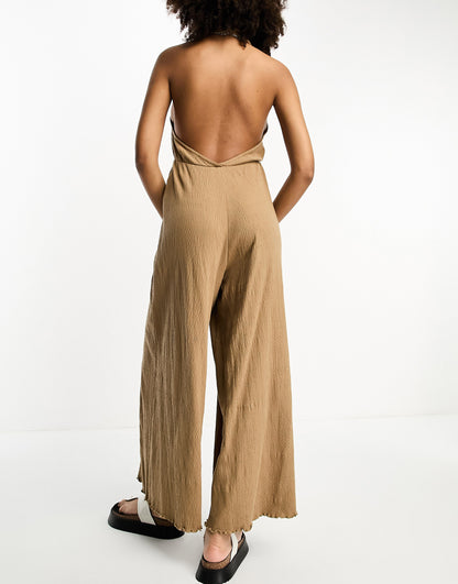 ASOS DESIGN crinkle jersey halter jumpsuit in mocha