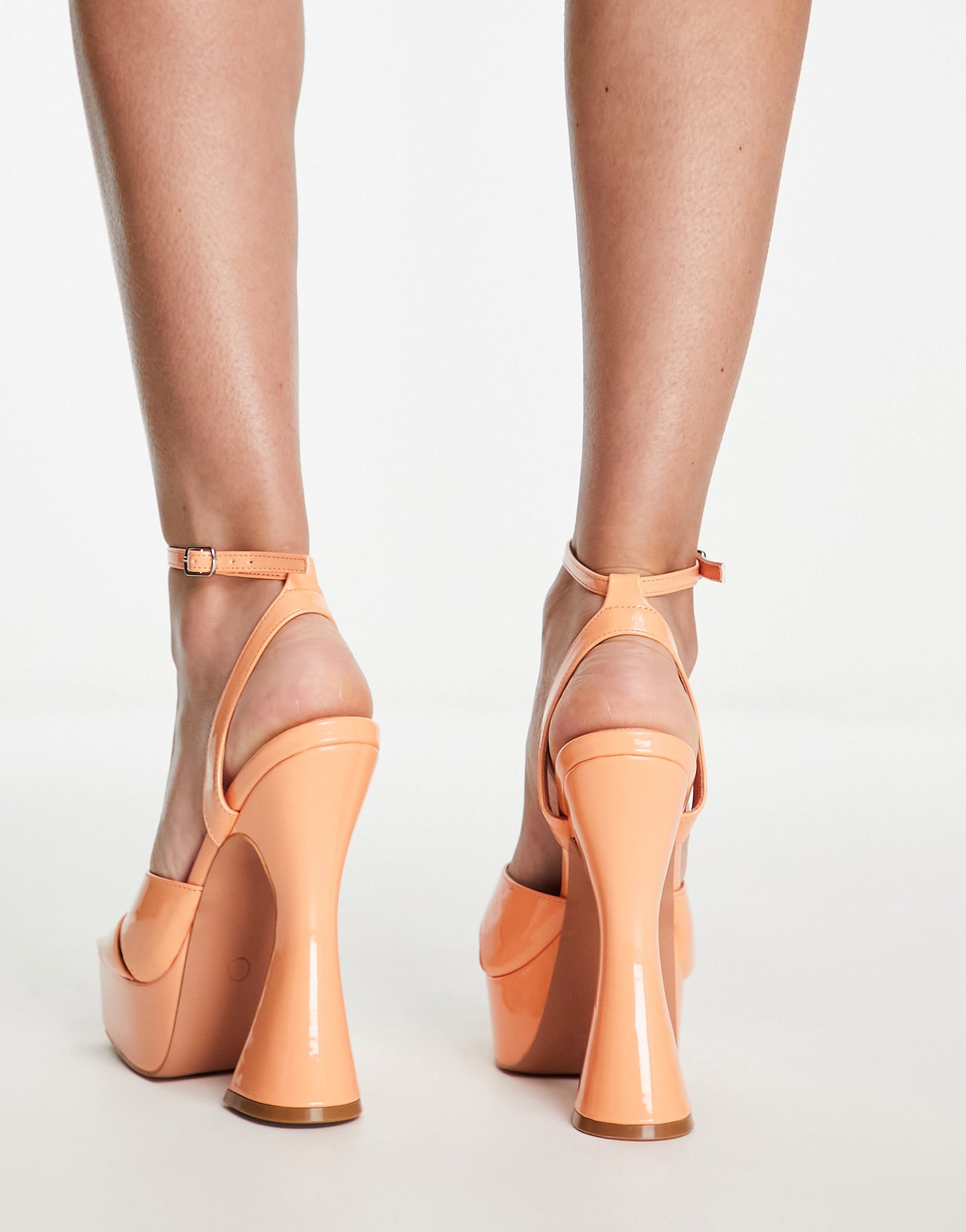 Simmi London Oceani platforms with flared heel in apricot patent