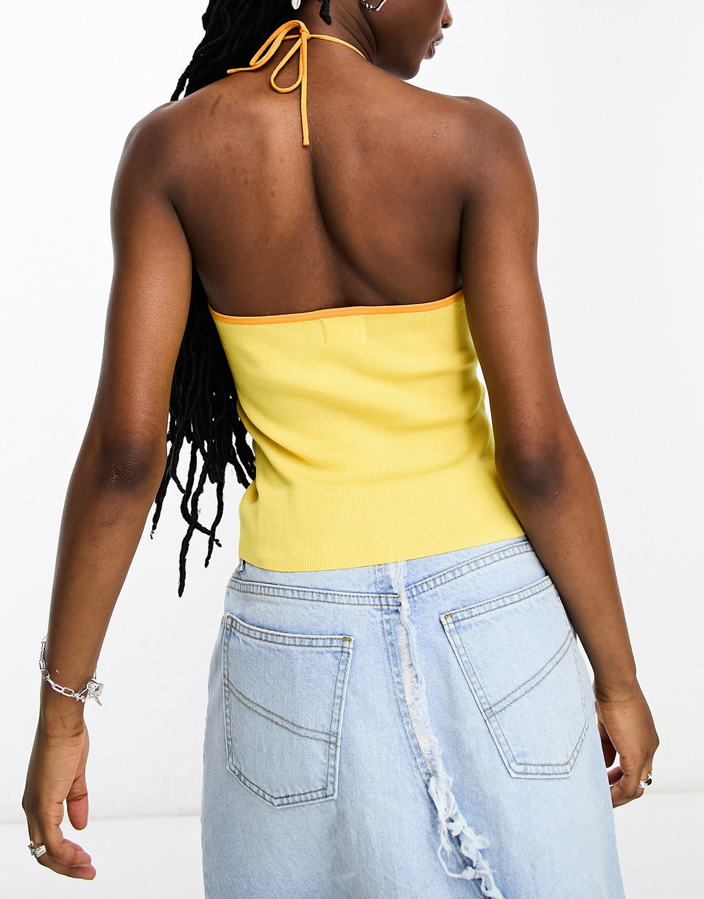 ASOS DESIGN knitted halter top with cut out detail and contrast trim in yellow