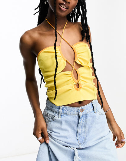 ASOS DESIGN knitted halter top with cut out detail and contrast trim in yellow