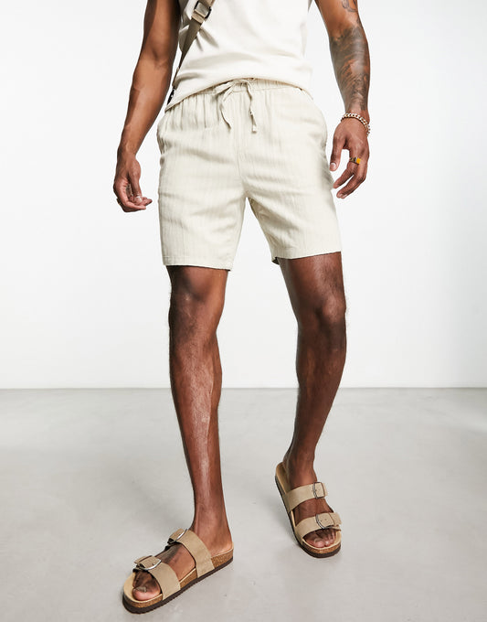 ASOS DESIGN slim texture shorts in mid length in beige