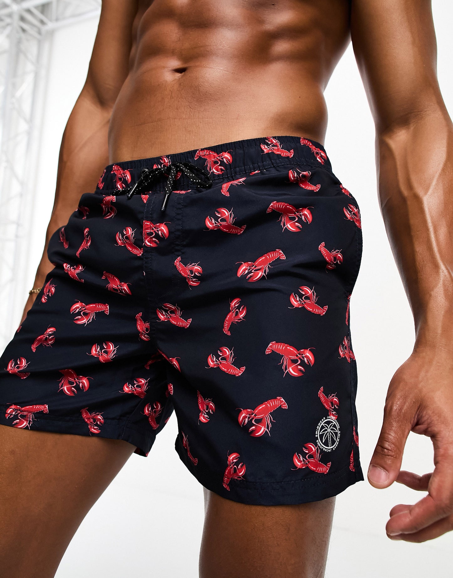 Jack & Jones Intelligence swim shorts in navy lobsterprint