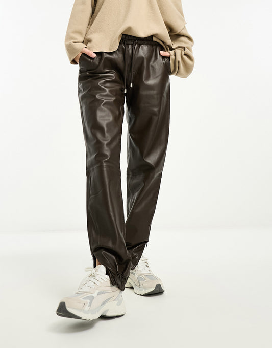 Muubaa elasticated leather joggers in brown