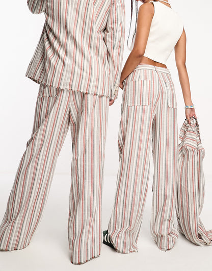 Reclaimed Vintage unisex limited edition suit trousers in summer stripe with fraying