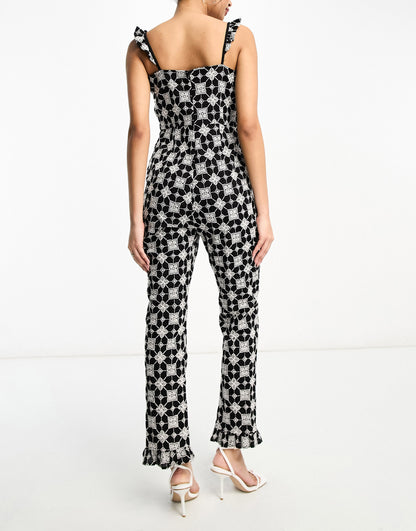 Never Fully Dressed broderie jumpsuit in monochrome print