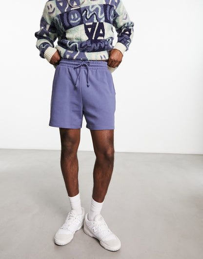 ASOS DESIGN oversized shorts in purple with text print