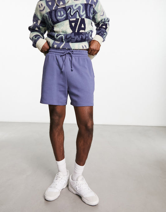 ASOS DESIGN oversized shorts in purple with text print