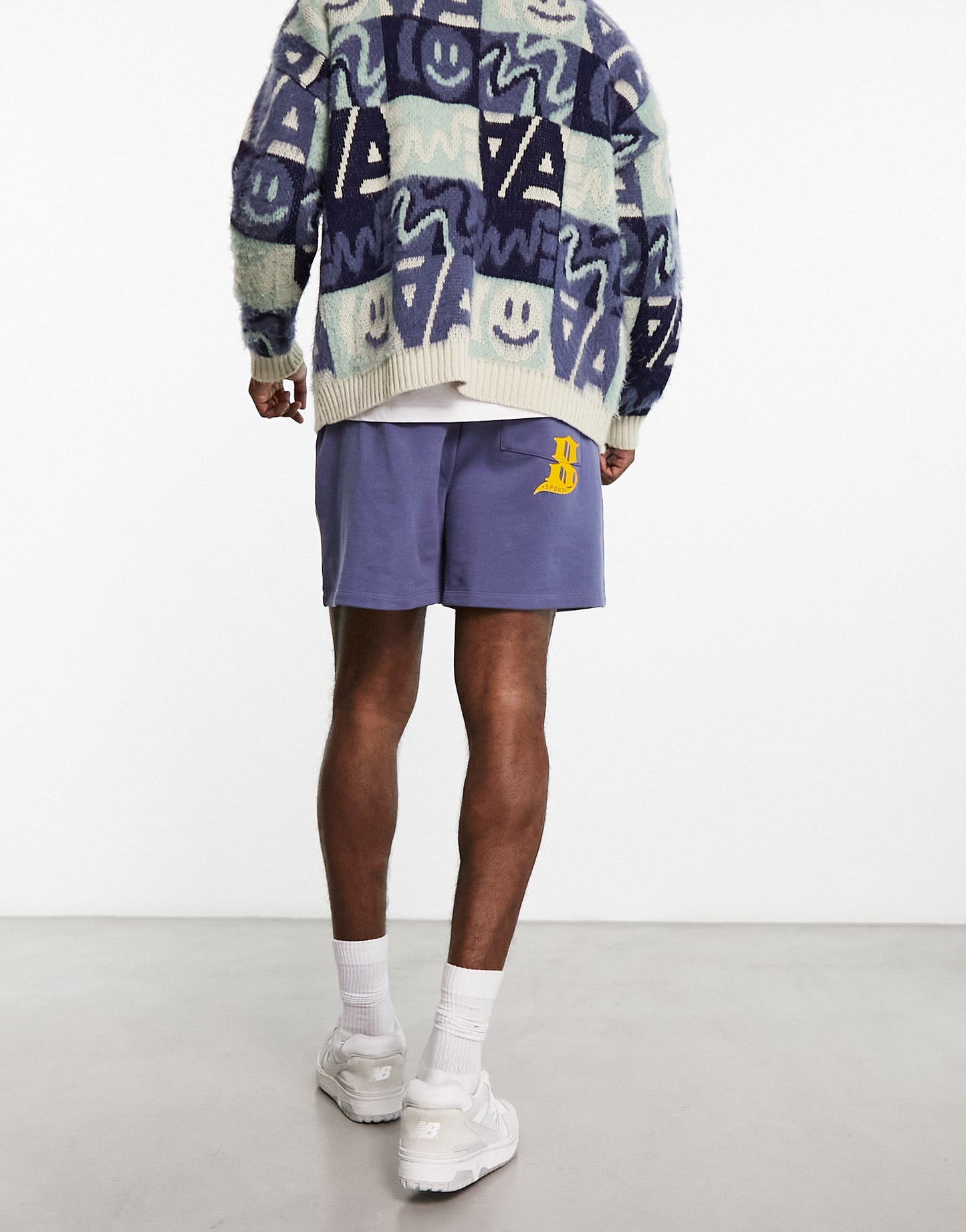 ASOS DESIGN oversized shorts in purple with text print