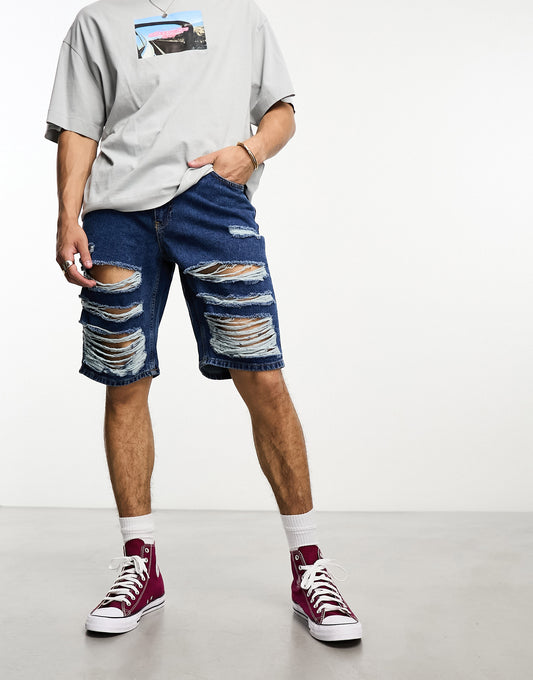 The Ragged Priest relaxed skate shorts with distressing in blue denim