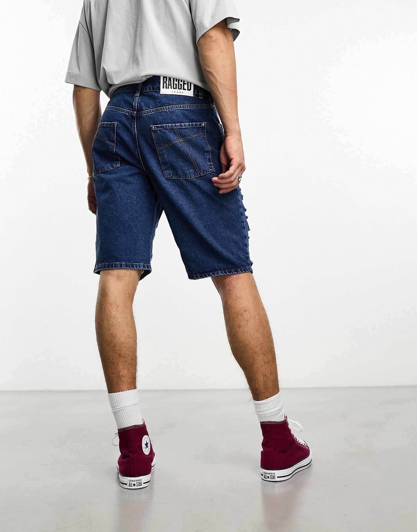 The Ragged Priest relaxed skate shorts with distressing in blue denim