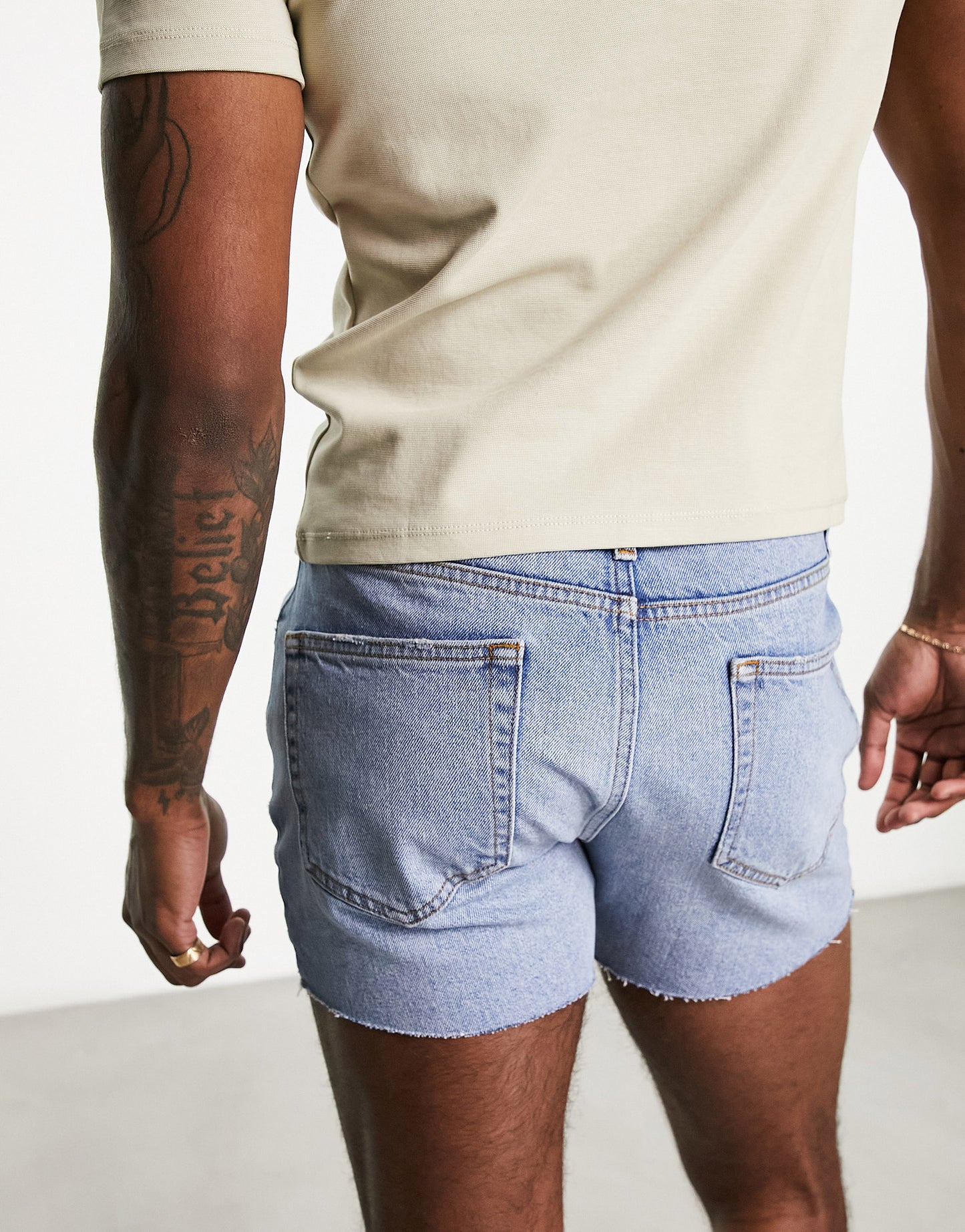 ASOS DESIGN slim shorter length ripped denim shorts in light blue wash