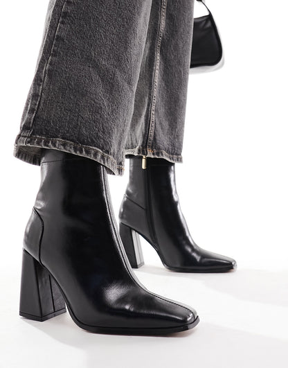 ASOS DESIGN Everest flared heel boots in black