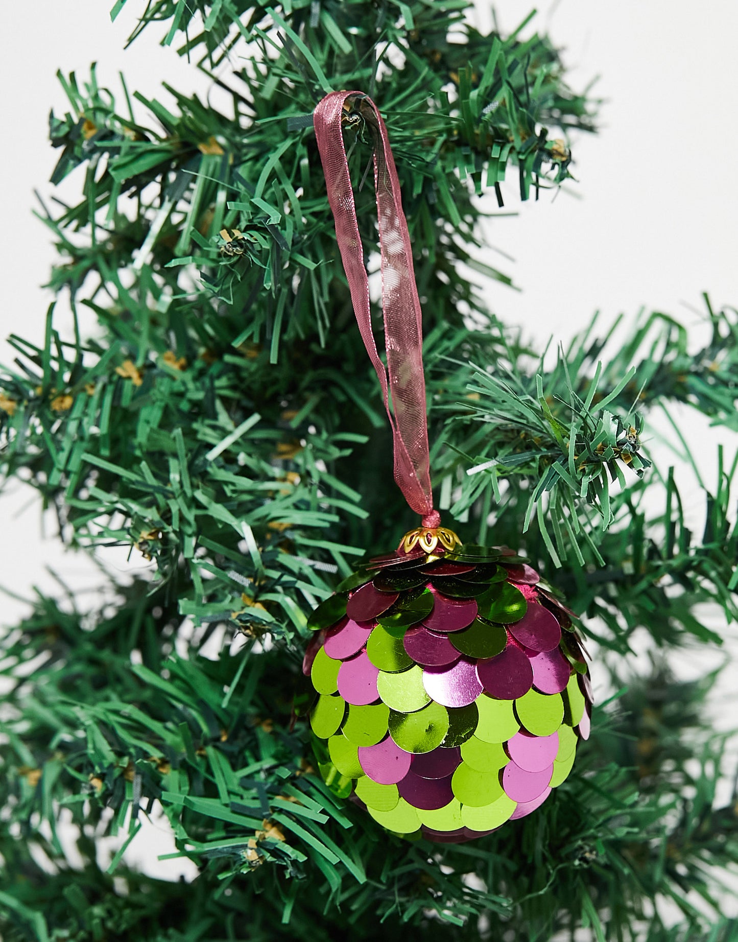 Accessorize disc sequin bauble in green and purple