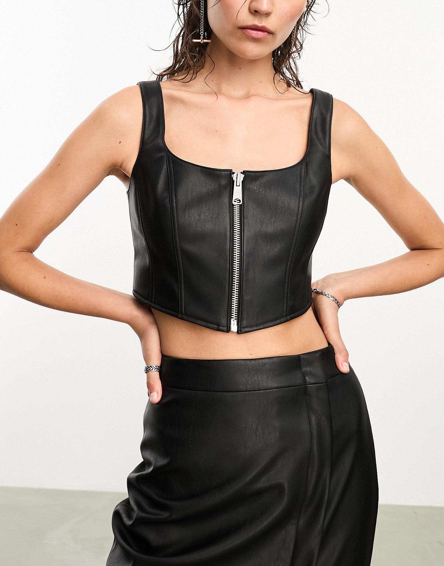 AllSaints x ASOS exclusive Odette faux leather zip through corset top in black