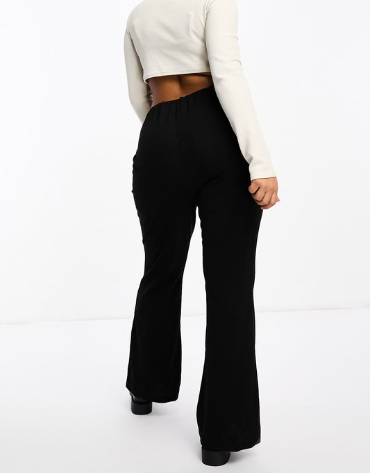 Vero Moda Curve jersey flare trouser in black